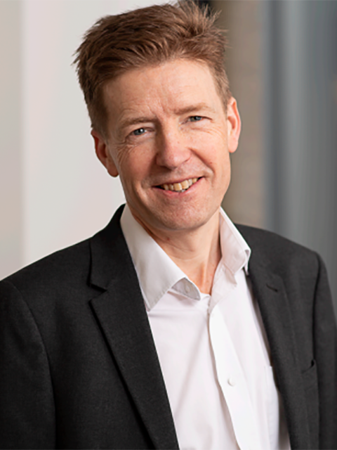 Portrait photograph of academic visitor to the School of Architecture, Building and Civil Engineering at Loughborough University, Andrew Cripps